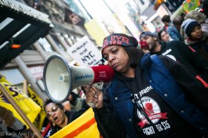 Woman with a megaphone at a protest.