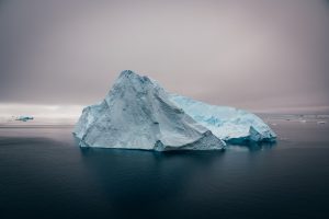 an iceberg floating in the ocean