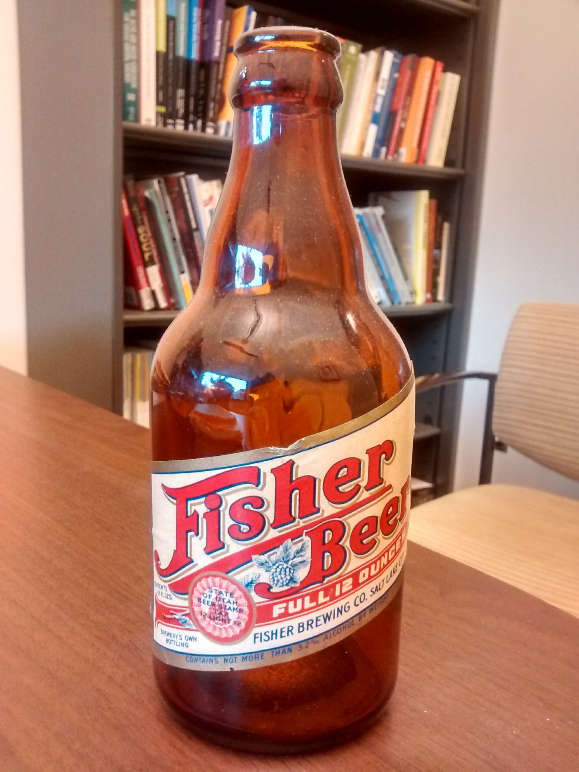 A picture of a beer bottle pulled from the attic: Fisher Beer.