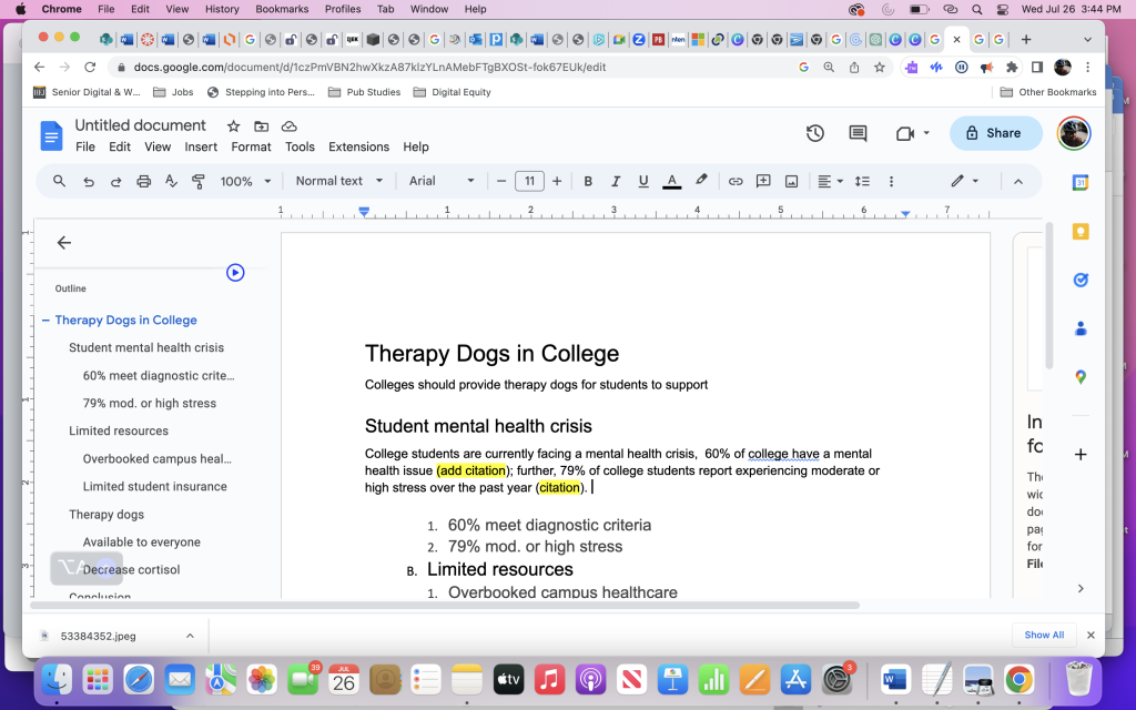 Google doc shows main document and accompanying outline. The document is an in-progress draft about therapy dogs on college campuses.