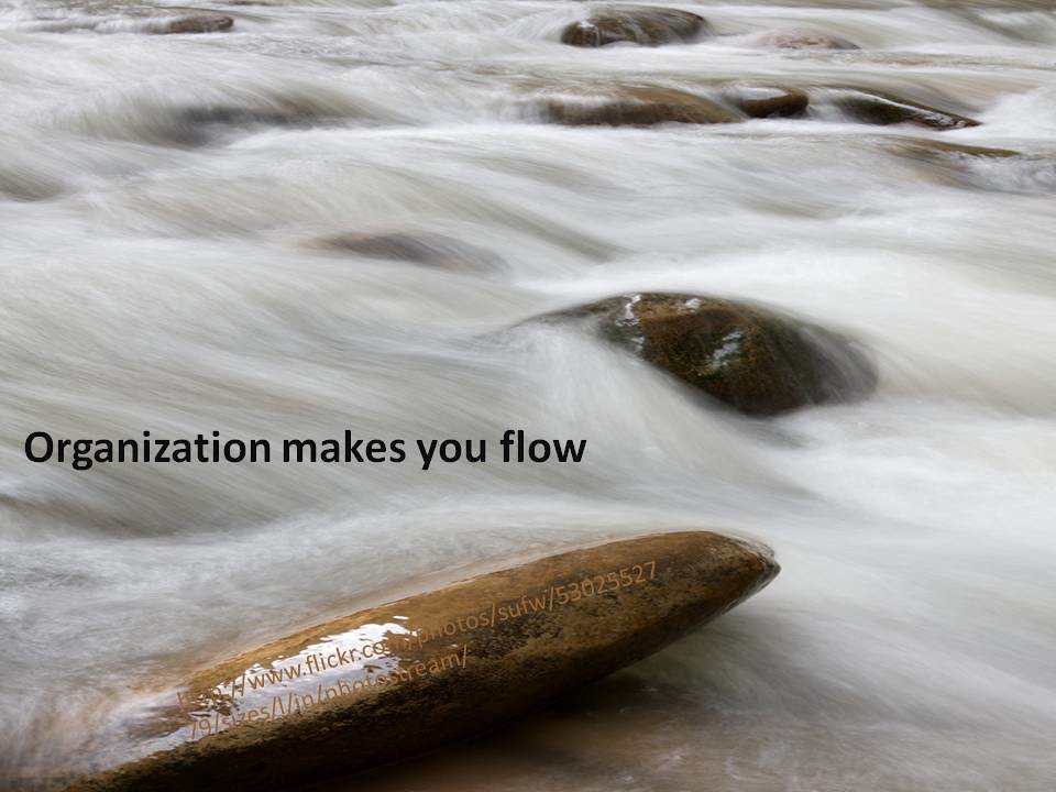 A motivational poster of water running over rocks.